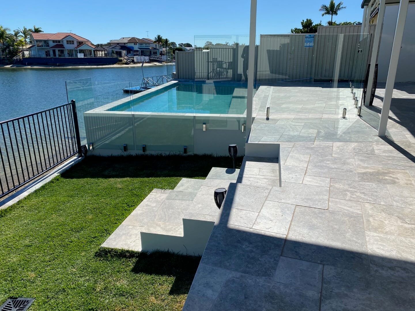 Pool Surrounds, Glass Pool Fencing, Tiled Outdoor Area