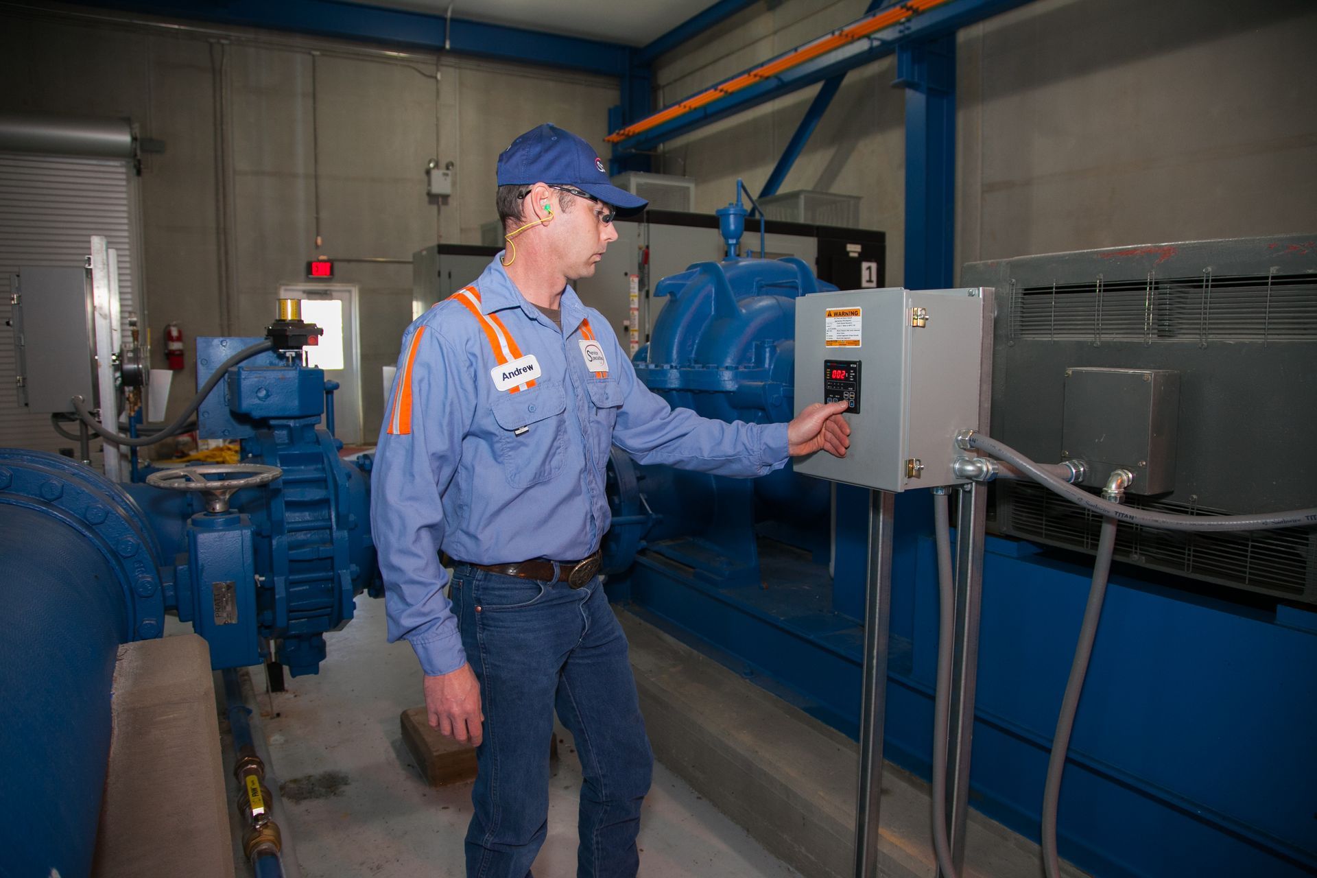 Workers inspecting industrial equipment in a utility facility and on outdoor machinery under repair