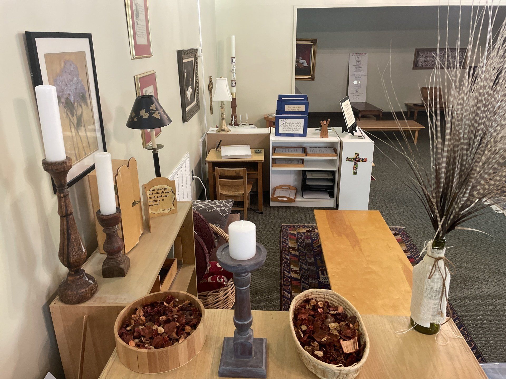 A room with a wooden table and candles on it