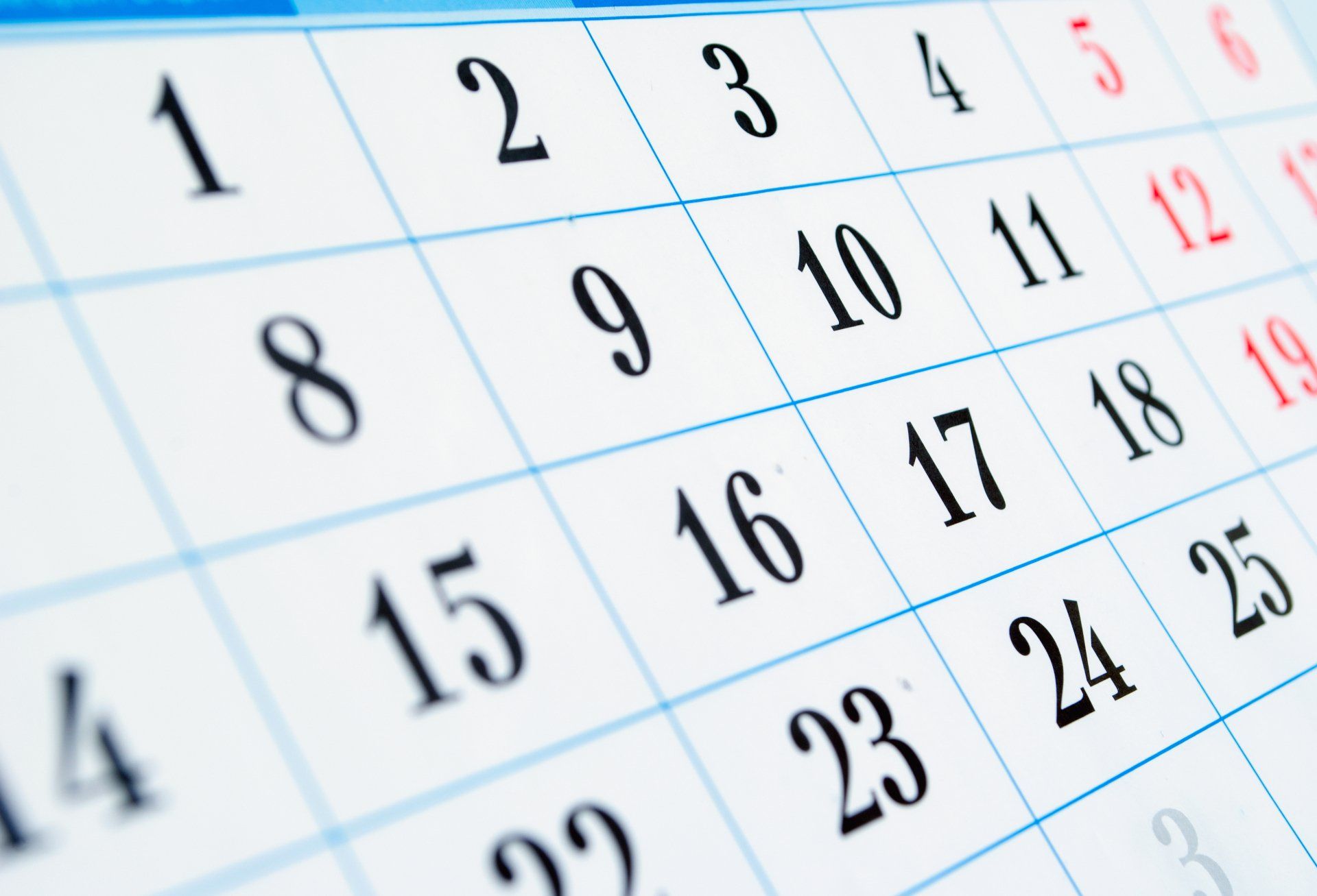 A close up of a calendar showing the numbers 1 through 25