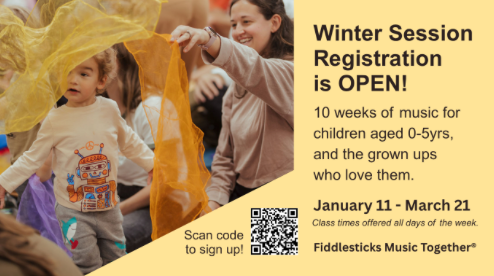 A group of children are sitting on the floor.