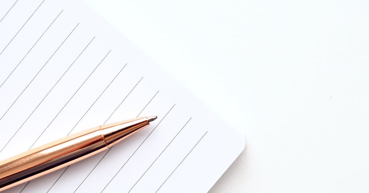 A pen is sitting on top of a piece of paper.