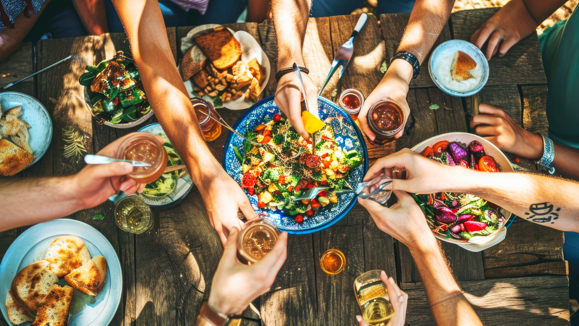 A row of lit candles on a black background