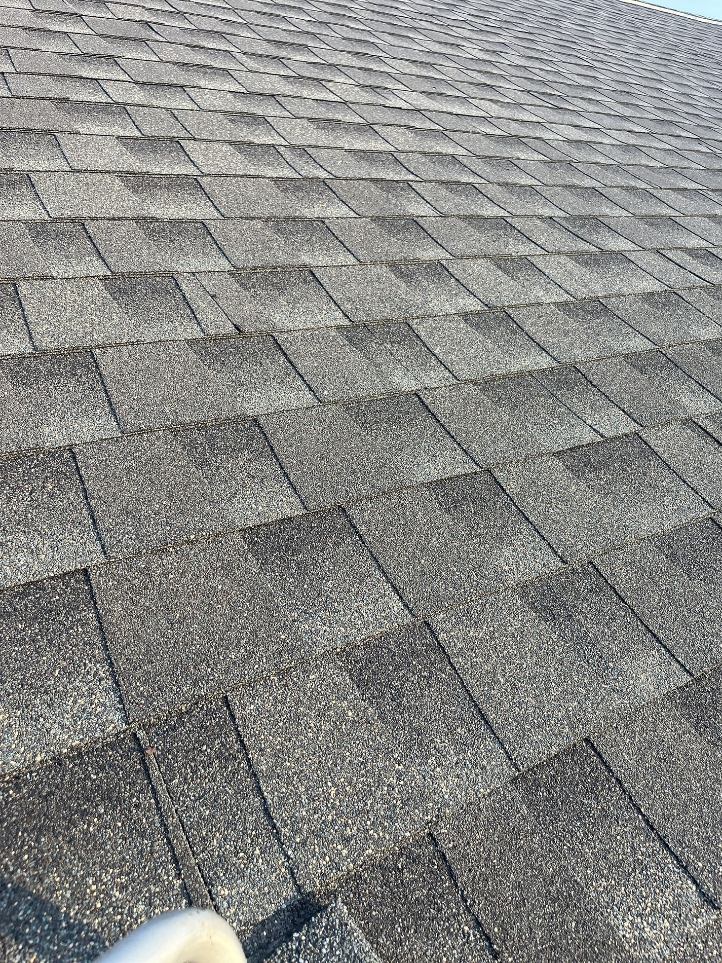 A close up of a roof with shingles on it.