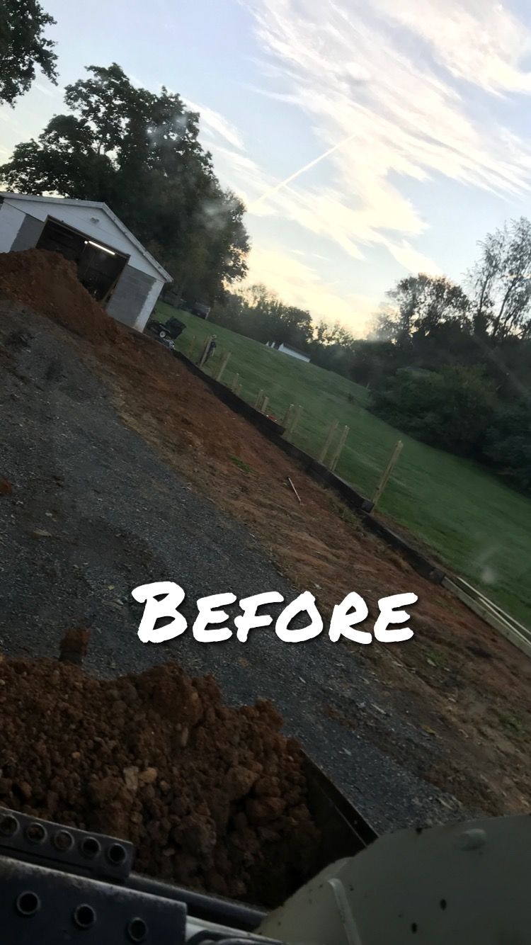 A muddy hillside with a small white building, labeled 