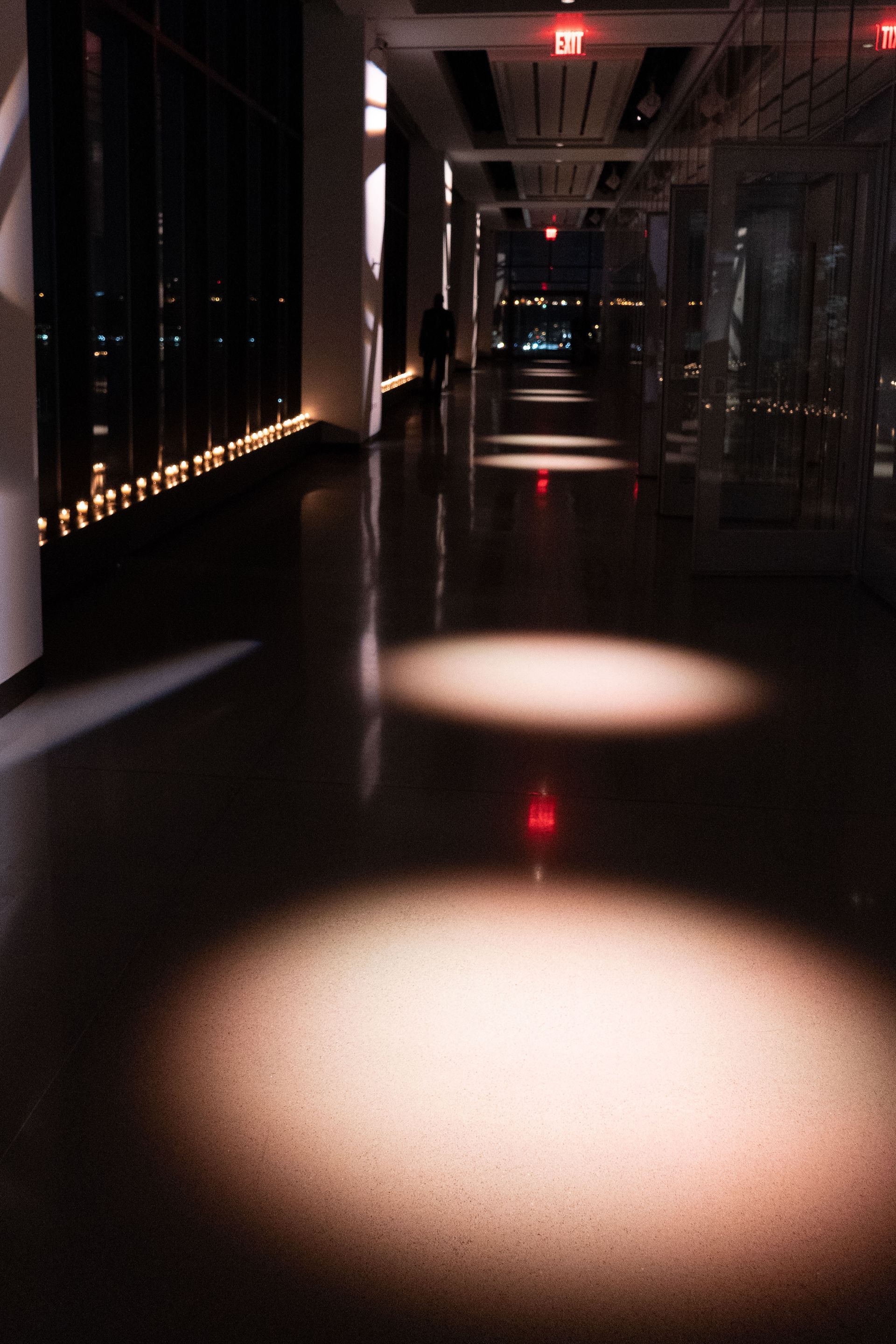 A hallway with a red light on the floor