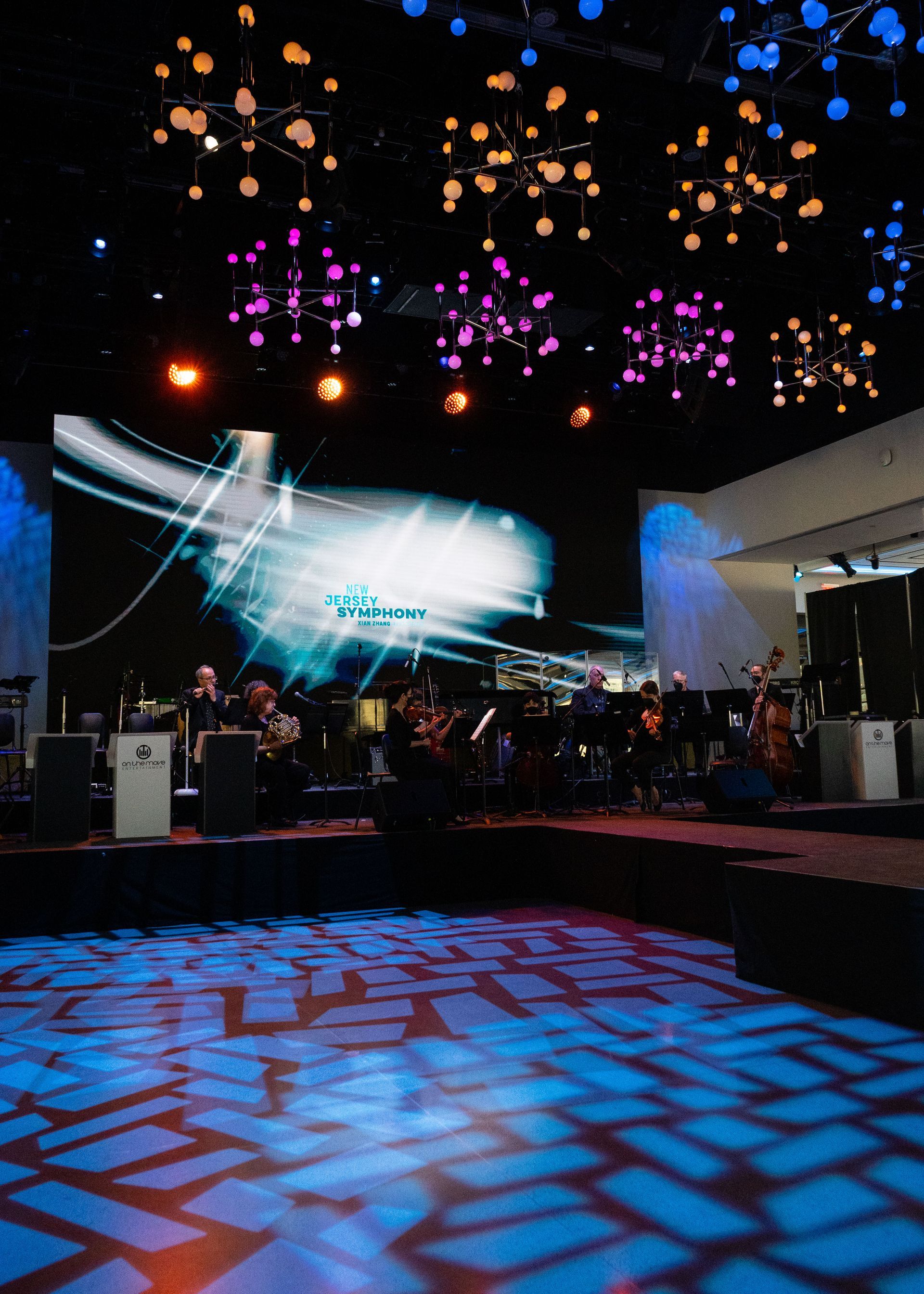 A stage with a large screen that says fusion on it