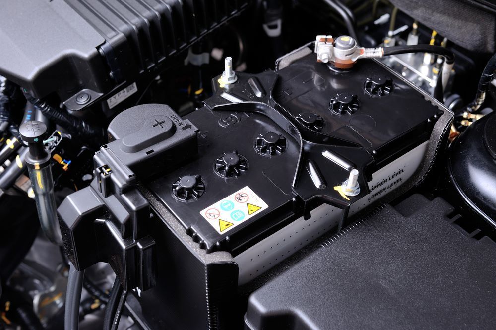 A Battery is Sitting Under the Hood of a Car — P & R Automotive Services in Pialba, QLD 