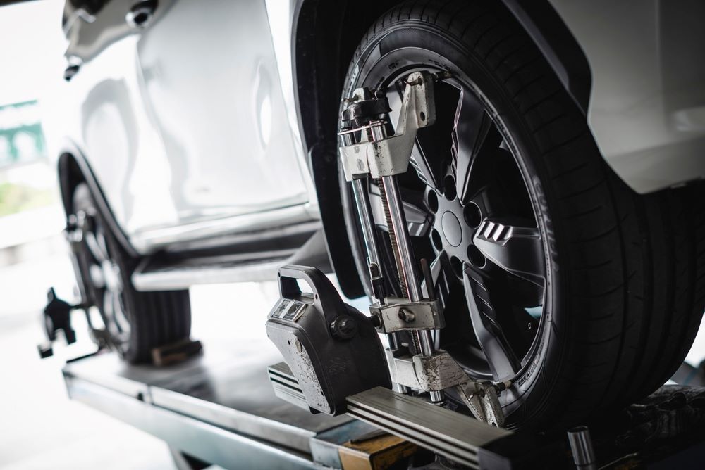 A Car is Being Adjusted in a Garage — P & R Automotive Services in Pialba, QLD 