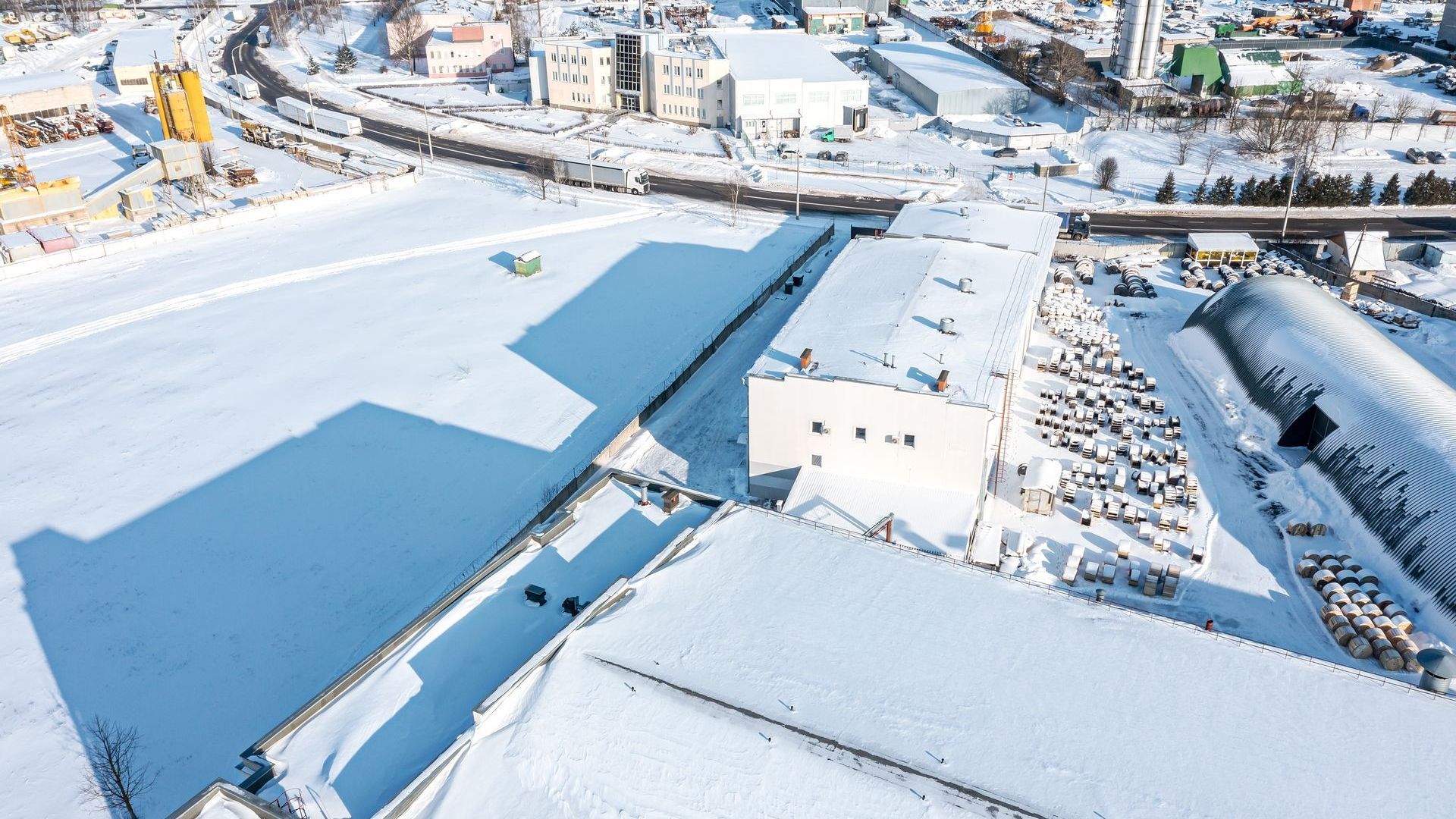 An aerial view of a city covered in snow