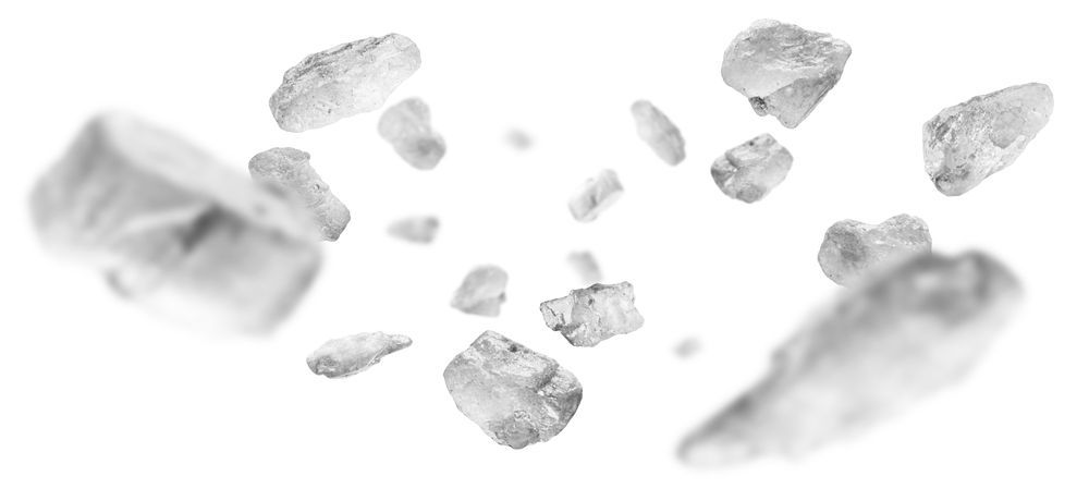 Scattered white chunks float against a bright white background.