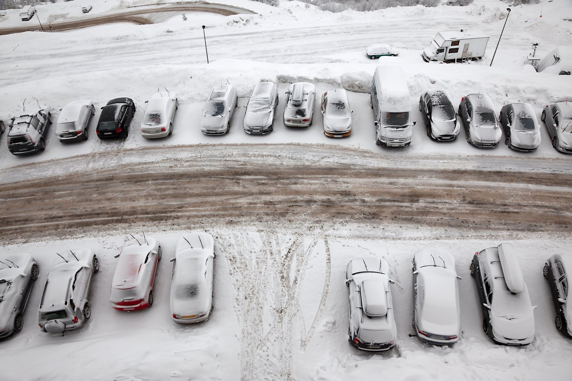 a commercial parking lot covered in snow near Elgin, IL