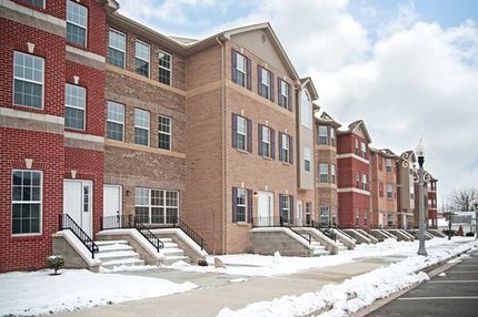 a condominium complex covered in snow