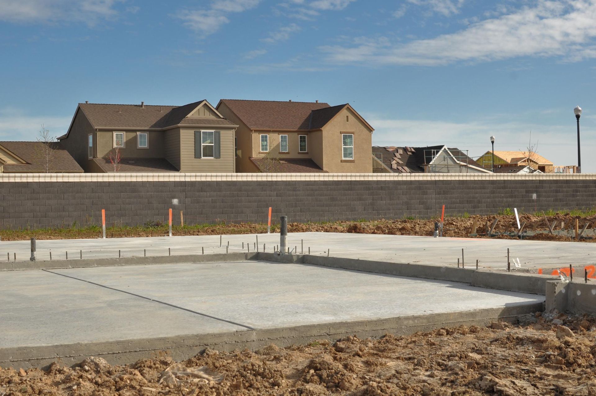 a large concrete slab in front of a row of houses