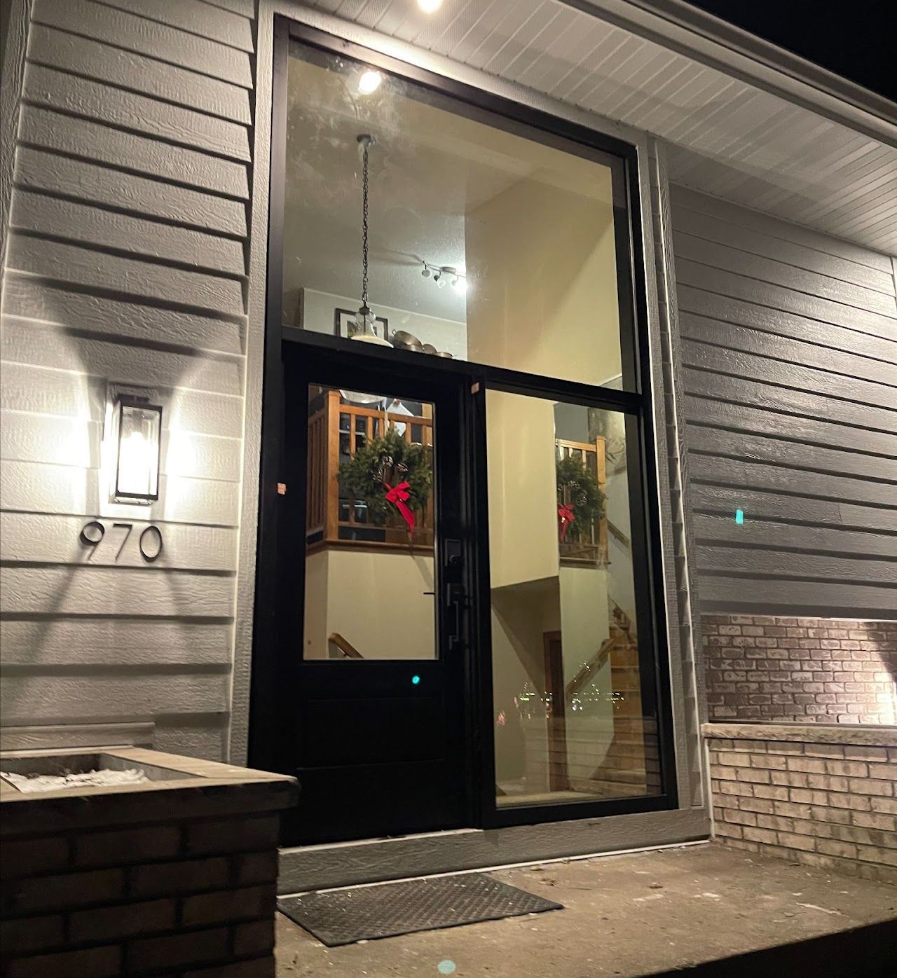 The front door of a house with the number 970 on it