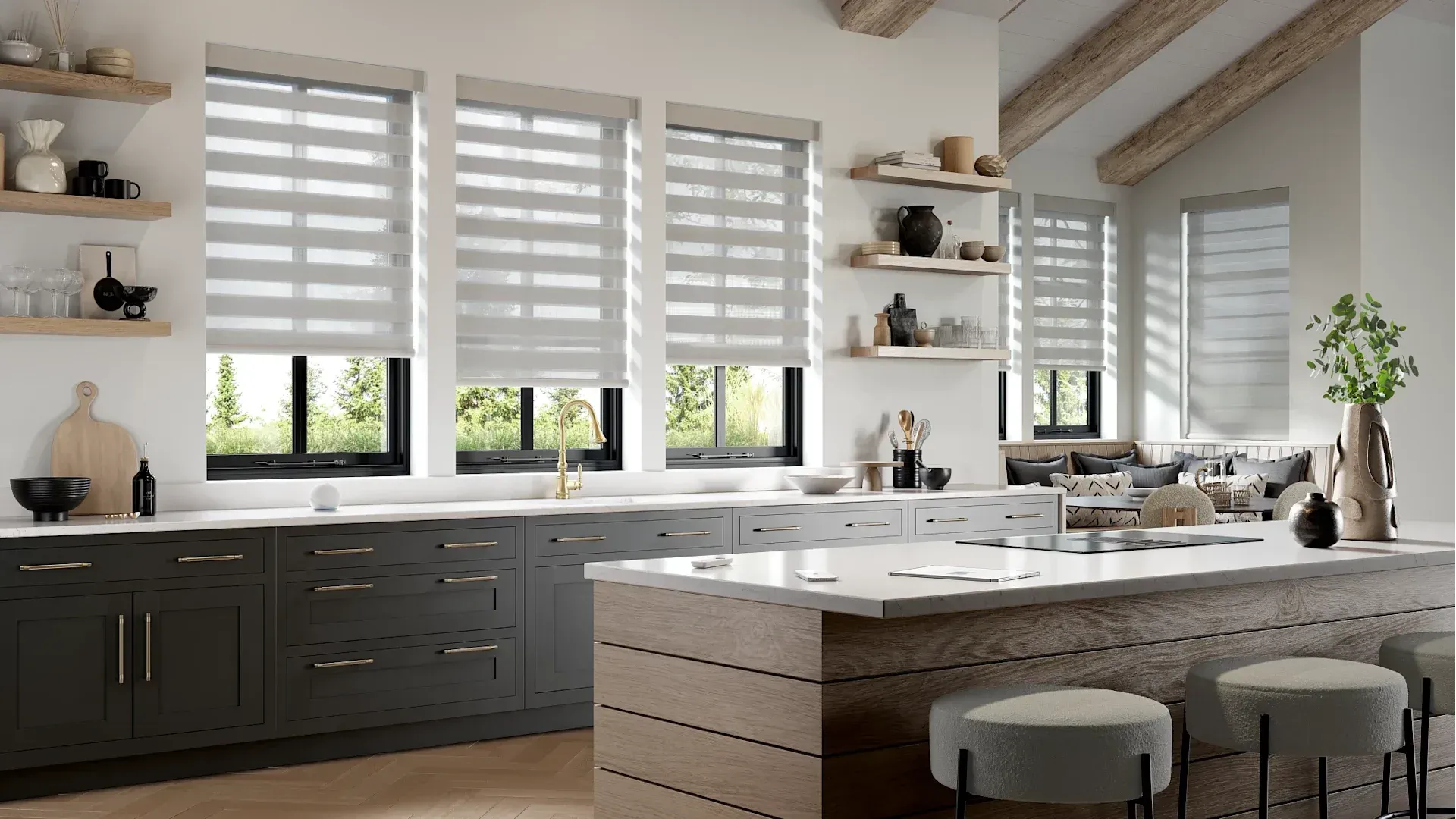 A kitchen with a large island and a lot of windows.