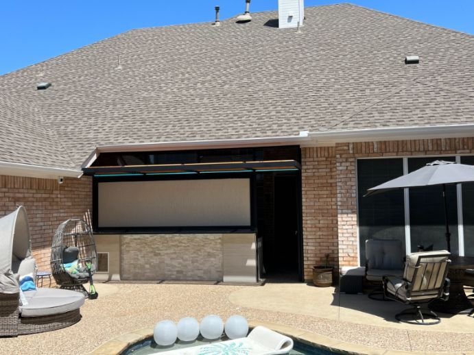 A pool area has an exterior patio shade hiding a section of the recreation area.