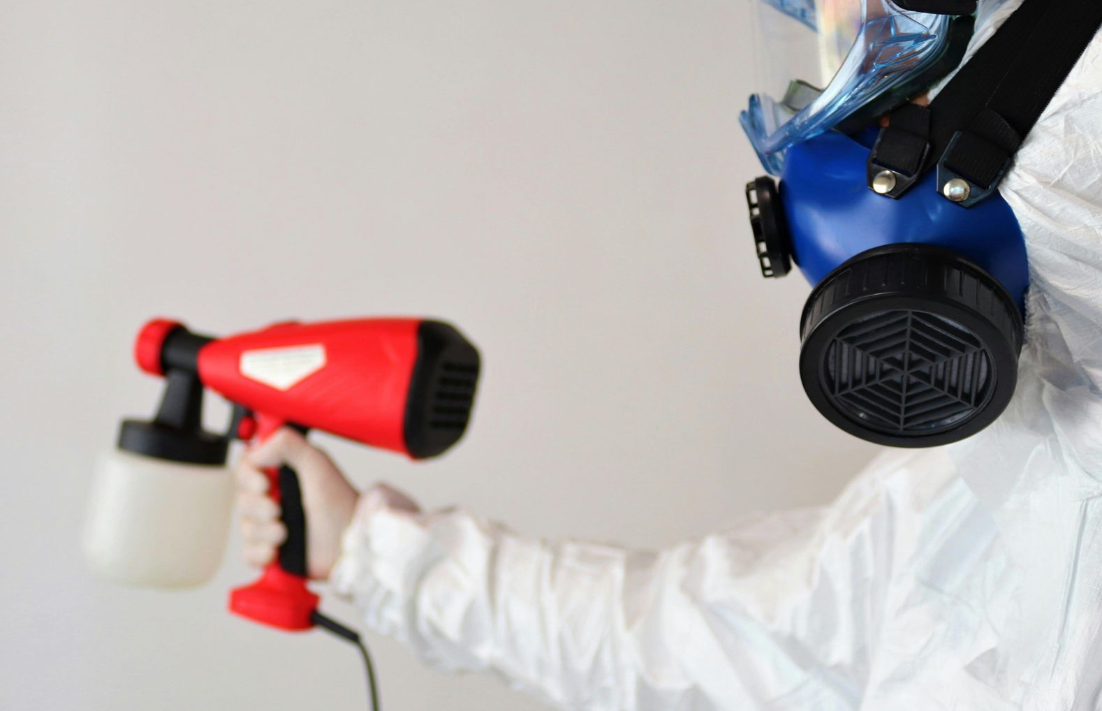 Mold removal specialist performing a treatment on an area of concern