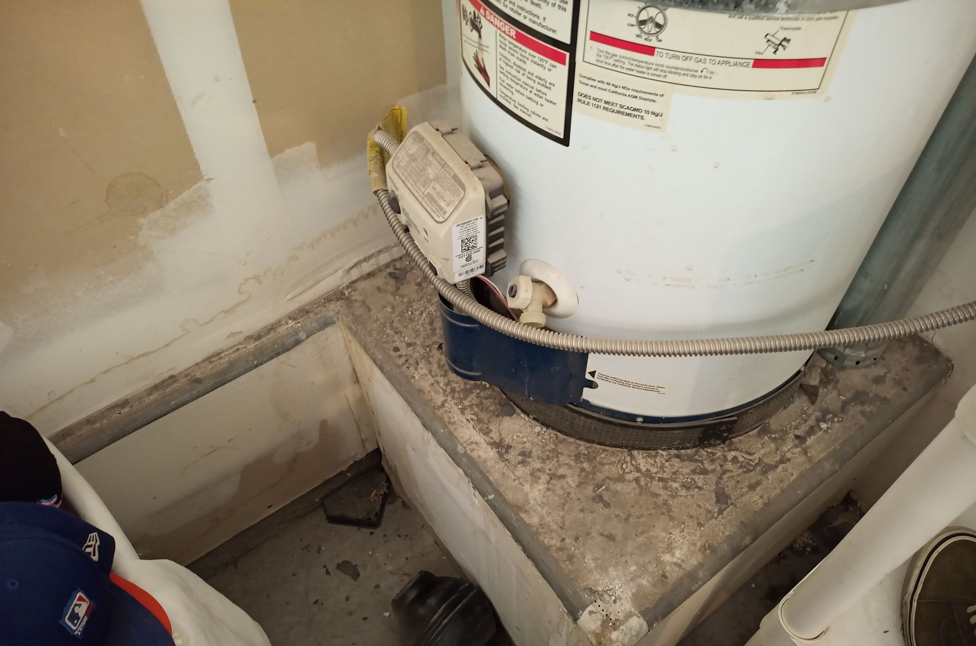 Base of hot water heater with moisture and mold issues.