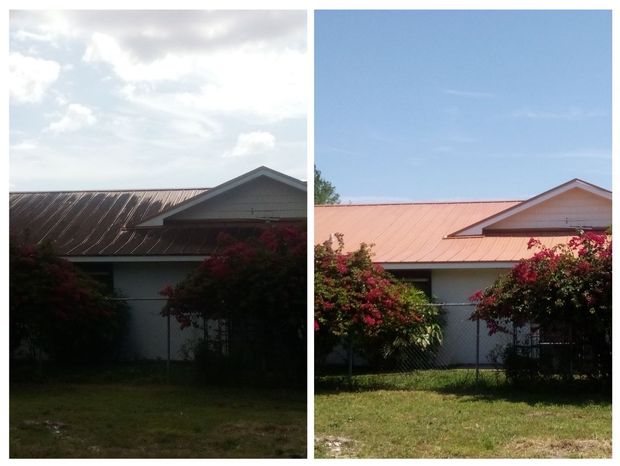 Picture of a roof in Port St. Lucie, Florida with a stained black roof.