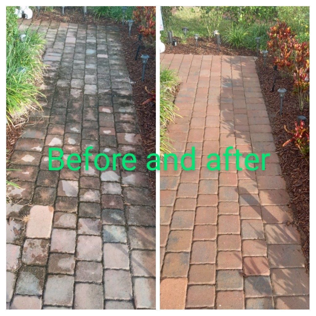 Image of a walkway that has been pressure washed. You can see a paver sidewalk leading to a house that shows the before and after color effects. You can see the before section of the sidewalk is darker than the after-pressure cleaning section of the image.