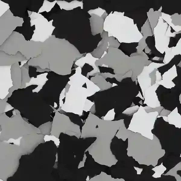 Abstract camouflage pattern in black, white, and gray shapes resembling torn paper or scattered leaves