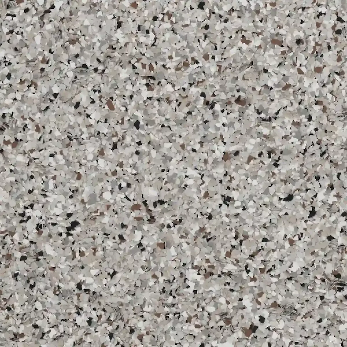 Close-up of a gray speckled granite surface with black, white, and pink flecks