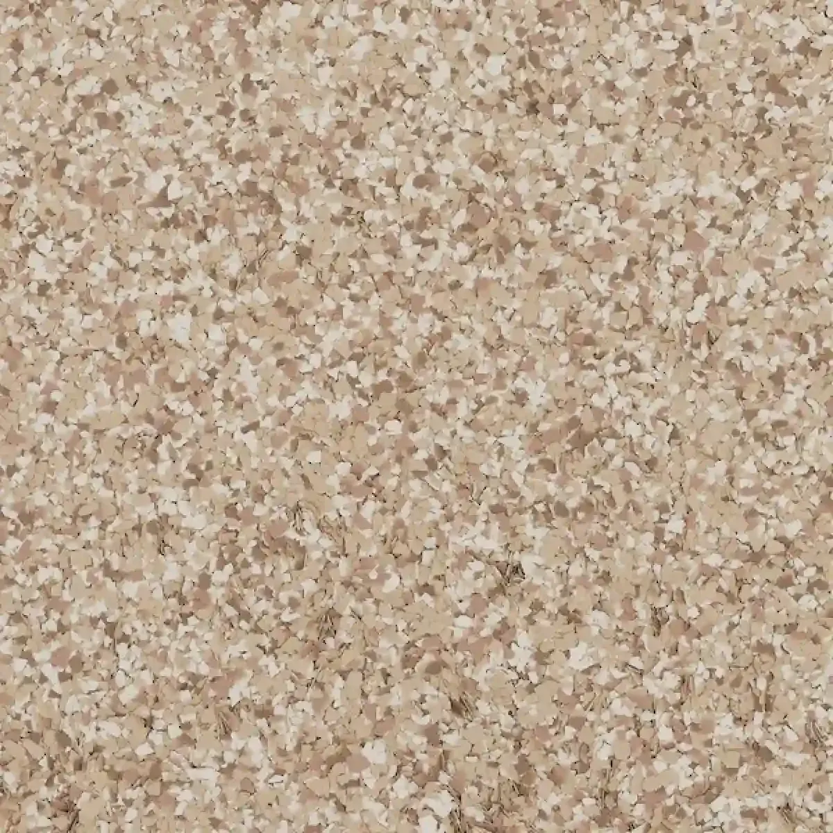 Close-up of a beige and tan speckled stone or textured surface