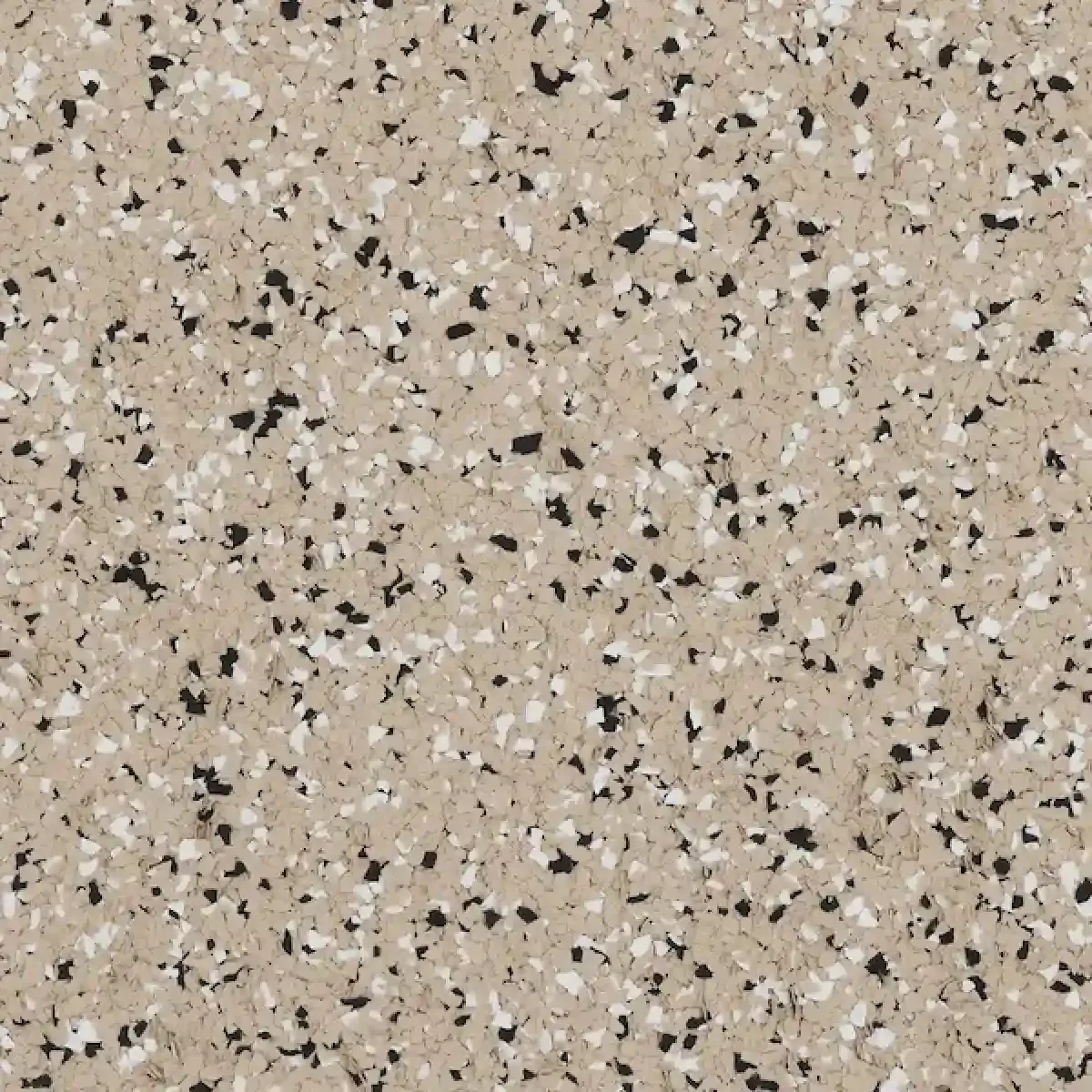 Tan speckled terrazzo-like surface with black, white, and gray flecks