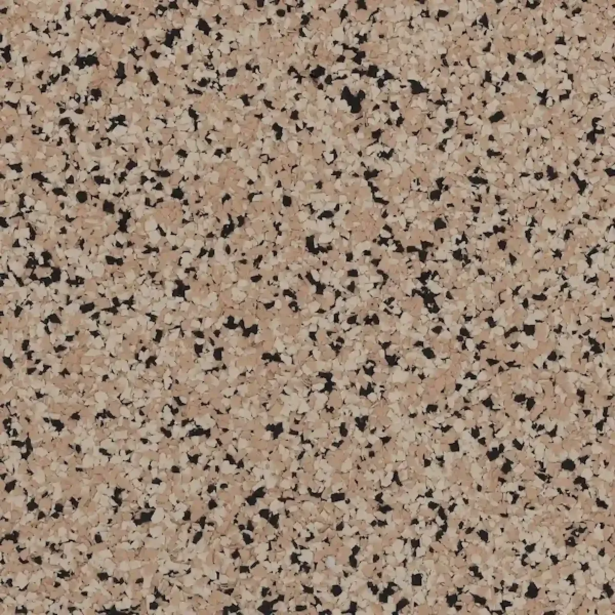 Speckled beige granite countertop surface with black and gray flecks