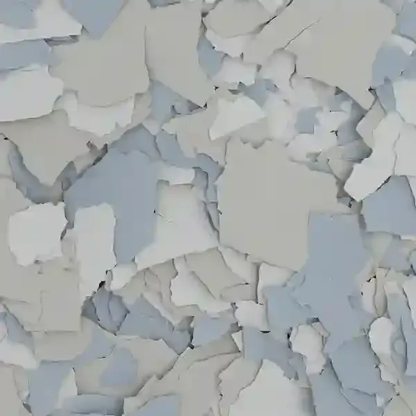 Layered white and pale blue paper flakes scattered across a flat surface