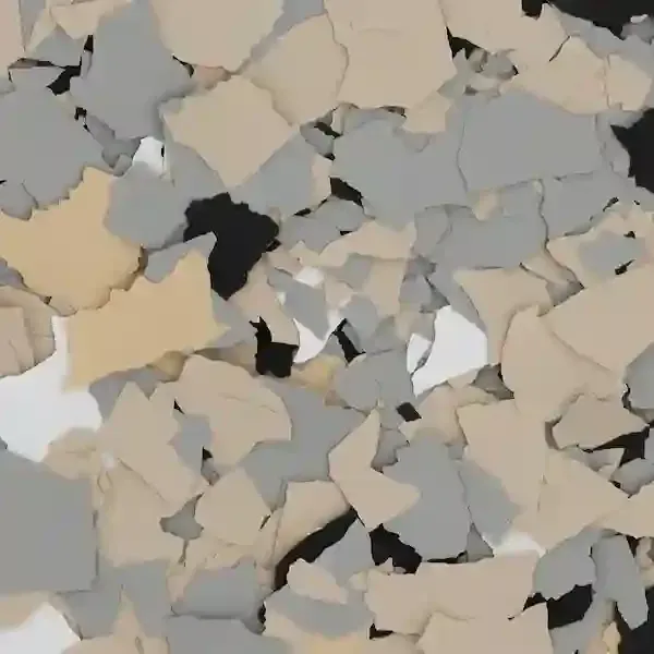 Scattered gray, beige, and white irregular paper confetti pieces covering the frame