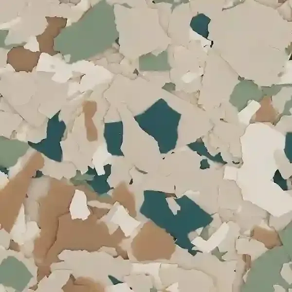 Close-up of chipped beige, white, and teal paint flakes on a surface
