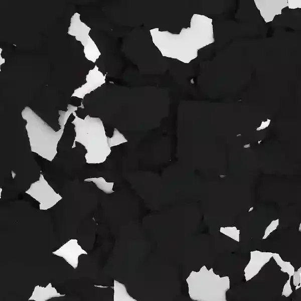 Abstract black surface with scattered white chipped patches and cracks