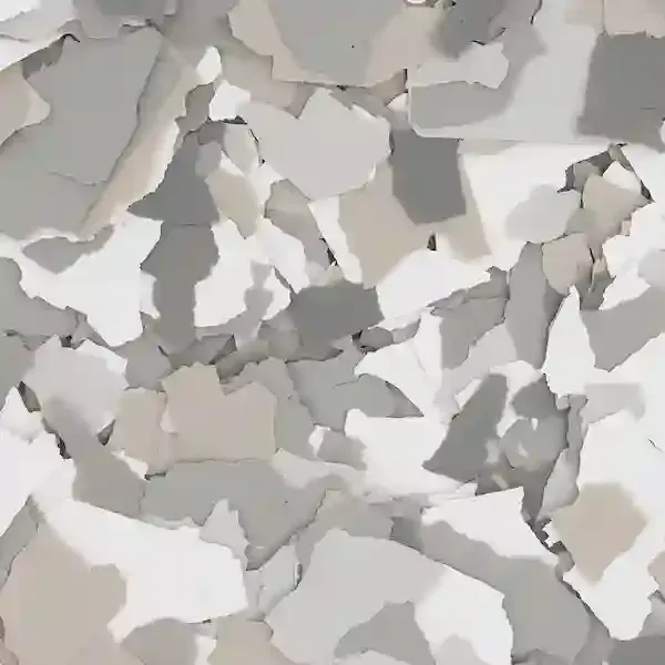 Abstract close-up of layered white, gray, and beige geometric shapes resembling torn paper or stone fragments