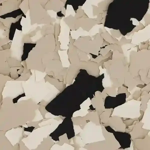 Beige and white paint chips scattered over a black background, creating a textured abstract pattern