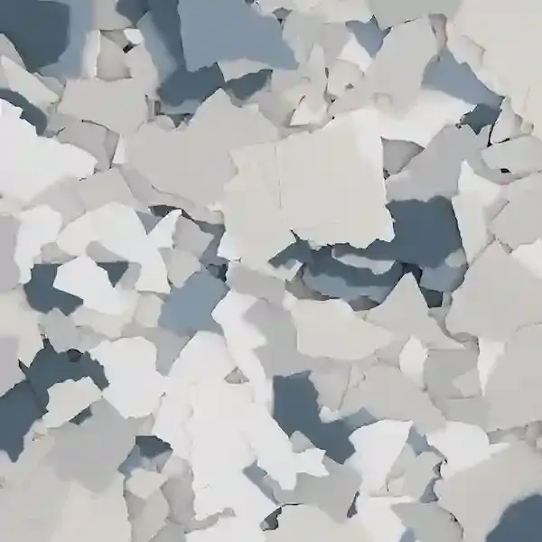 Scattered white and gray paint chips or paper scraps covering the surface