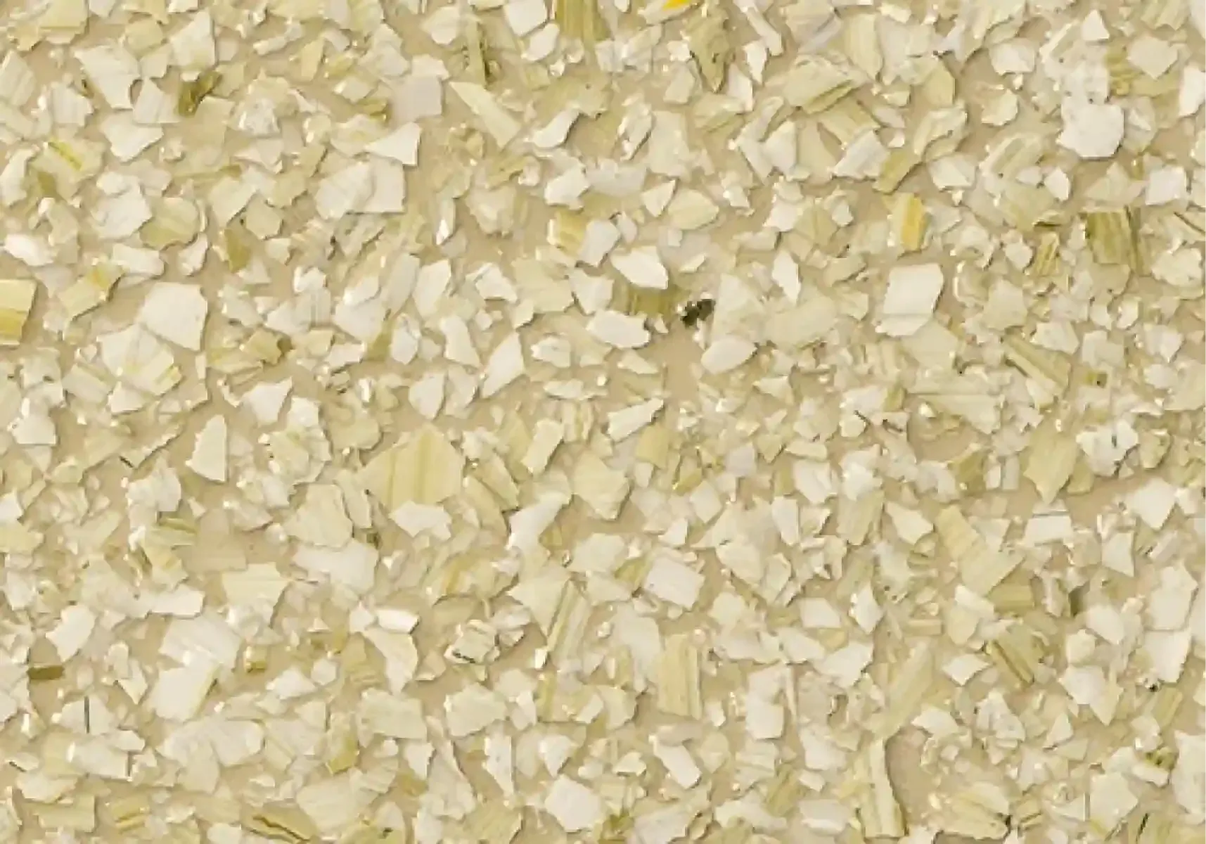 Close-up of pale yellow and white rice grains filling the frame.