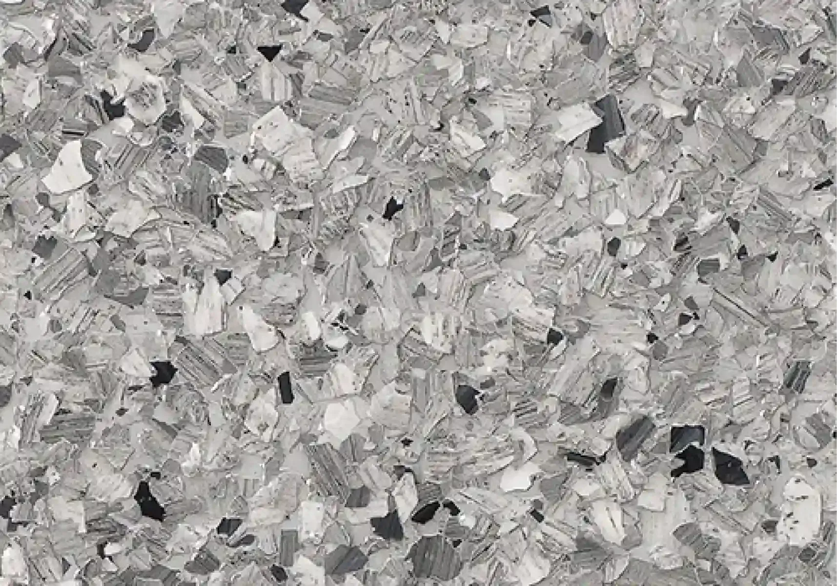 Gray and white speckled stone or concrete texture close-up