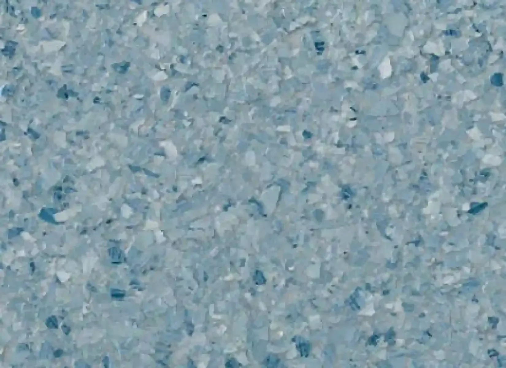 Close-up of light blue and white speckled textured surface