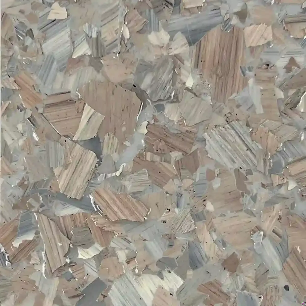 Abstract close-up of beige, gray, and tan wood chips or confetti-like texture