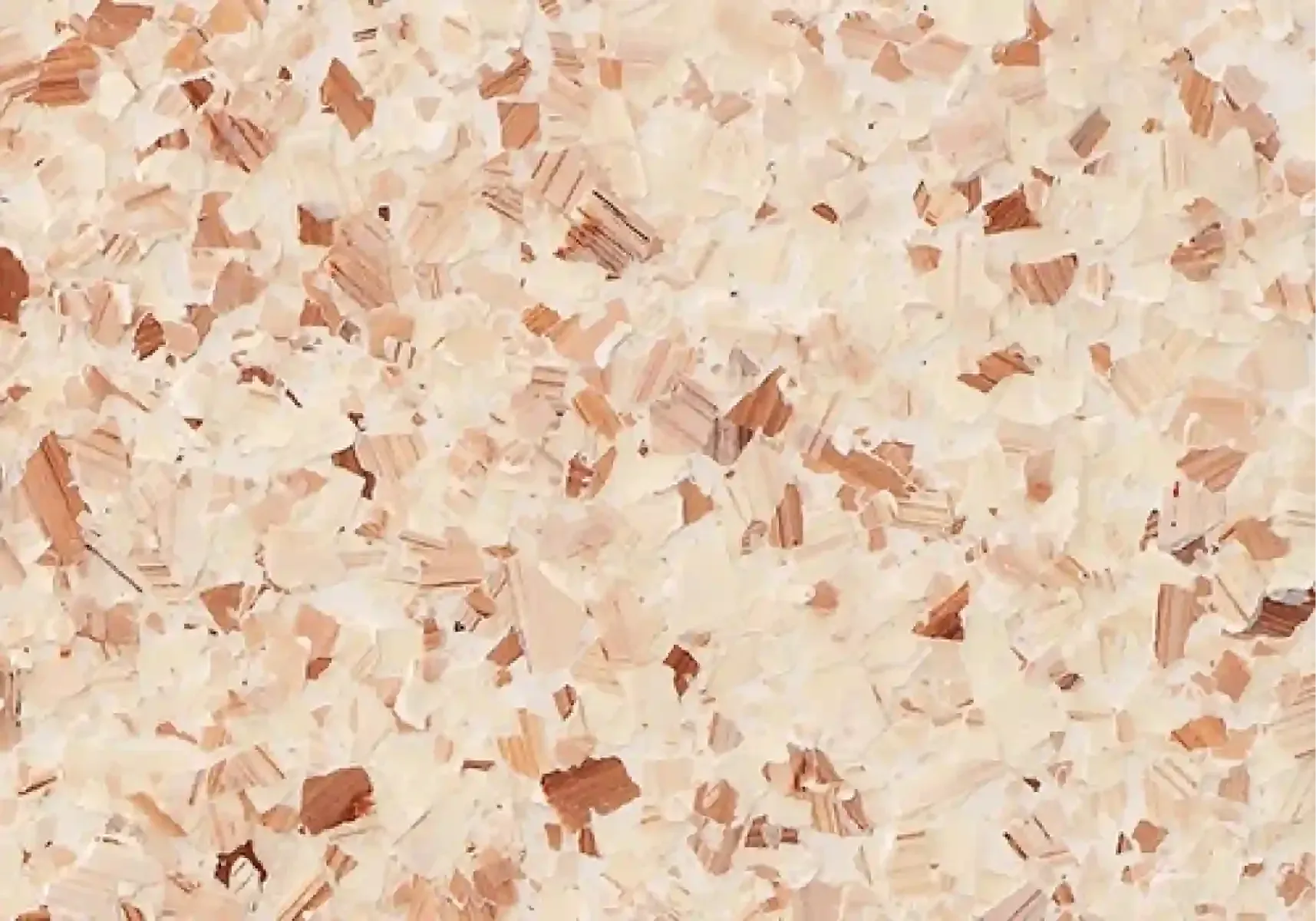 Close-up of a pale pink and beige speckled marble or stone surface