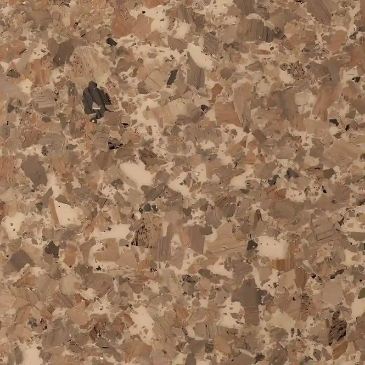 Close-up of speckled beige, brown, and tan stone or terrazzo surface
