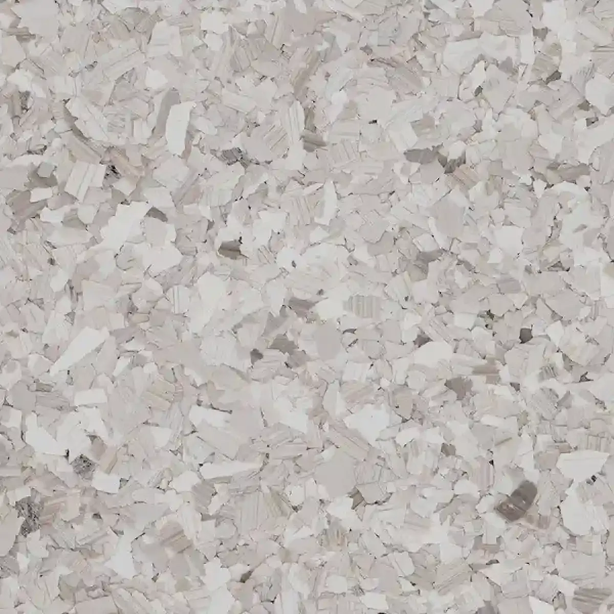 Close-up of light gray and white crushed stone or gravel texture