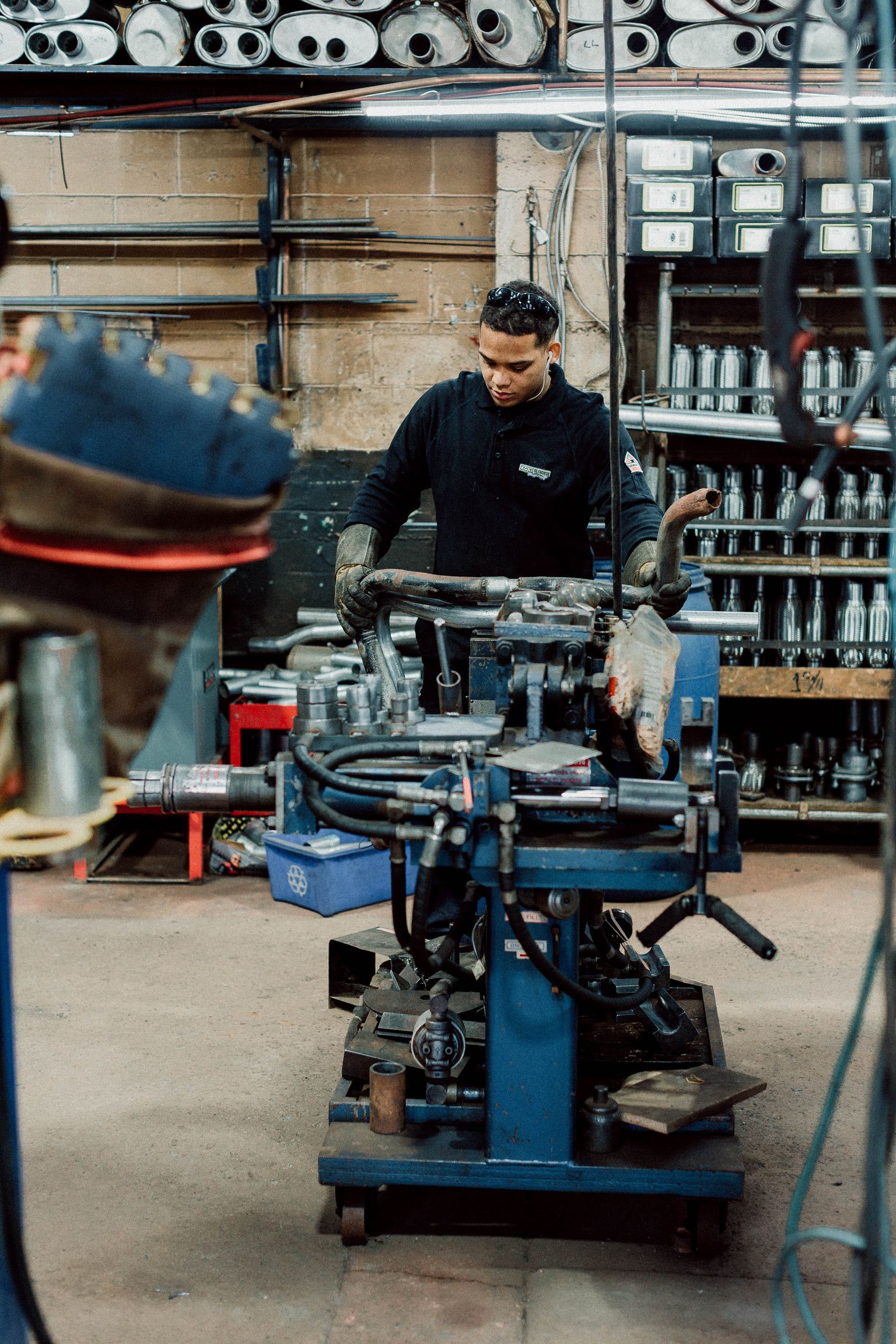 A man is working on a machine in a factory.