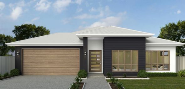 A House With A Garage Door And A Driveway In Front Of It — Ashlee Jones Homes in Gordonvale, QLD