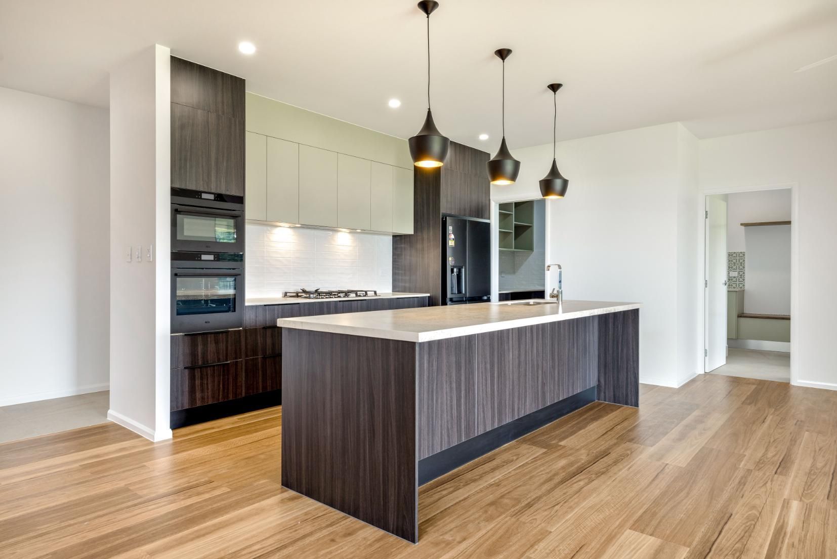 There is a Large Island in the Middle of the Kitchen — Ashlee Jones Homes in Gordonvale, QLD