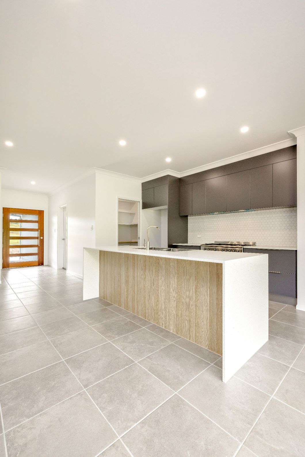 There is a Large Island in the Middle of the Kitchen — Ashlee Jones Homes in Gordonvale, QLD