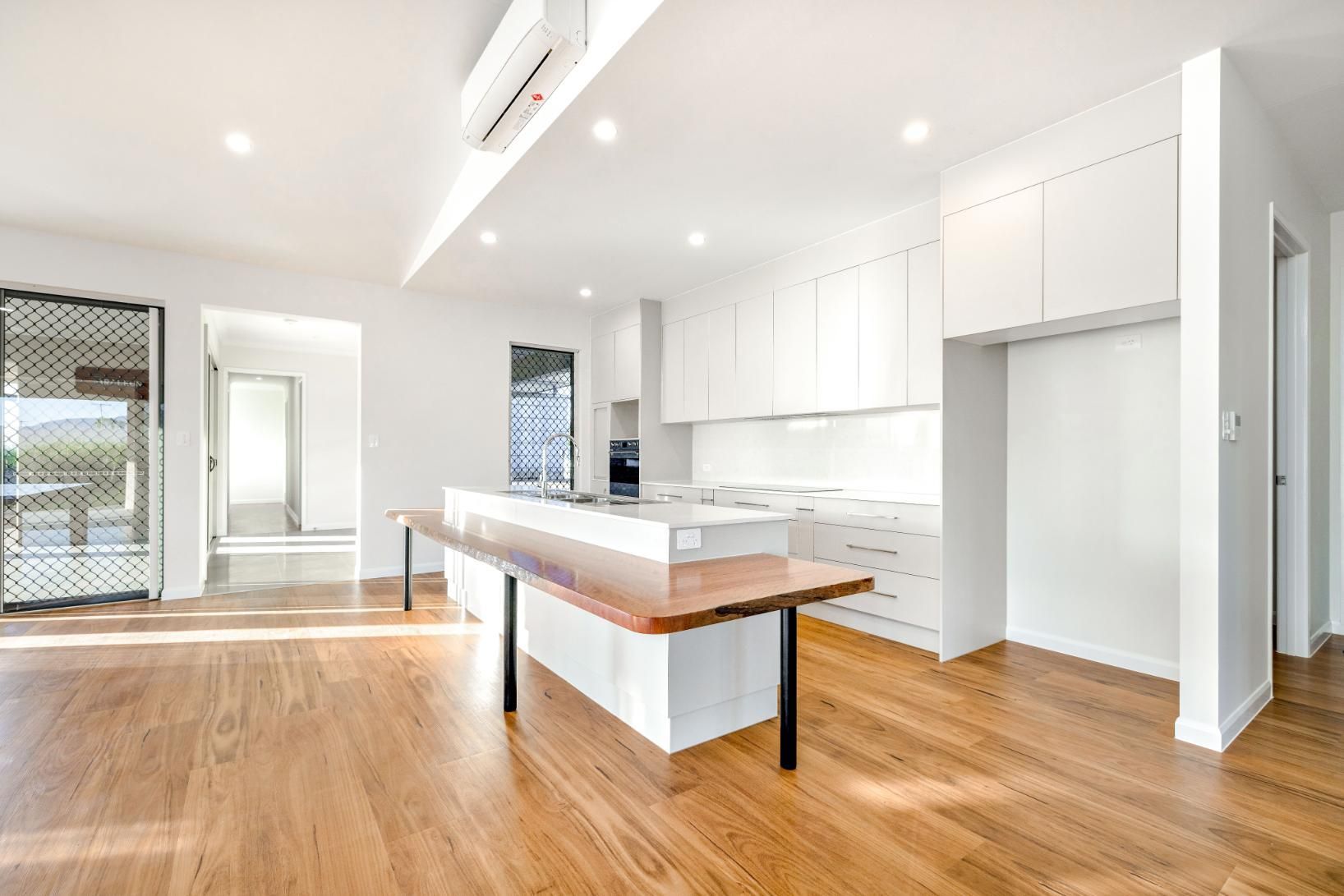 There is a Large Island in the Middle of the Kitchen — Ashlee Jones Homes in Gordonvale, QLD