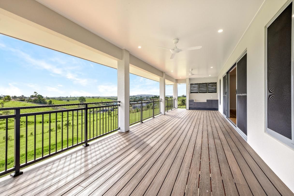 There is a Large Balcony With a View of a Field — Ashlee Jones Homes in Gordonvale, QLD